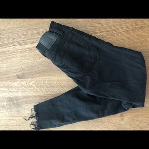 Women’s black distressed Levi’s